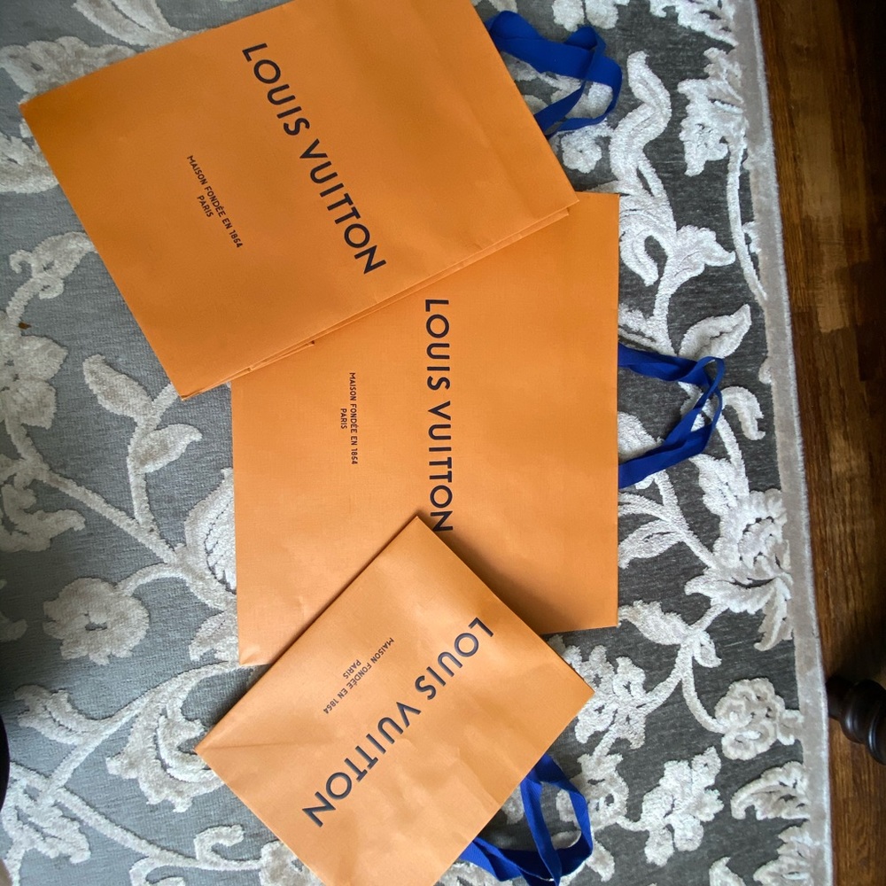 3 Louis Vuitton shopping bags